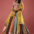 Multi Coloured Brocade Lehenga With Bandhani Print And Heavy Mirror Work On The Border