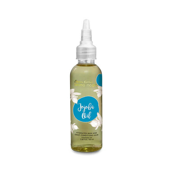 Bottle of Jojoba oil with a white cap on a white background