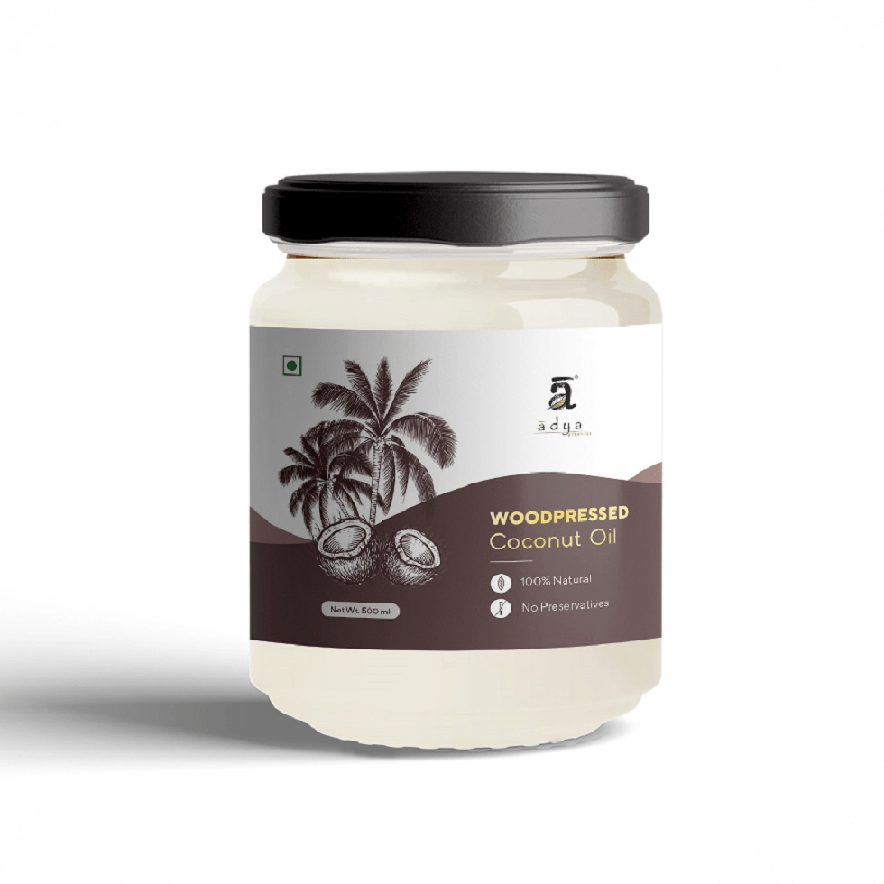 Jar of Adya Woodpressed Coconut Oil on a white background