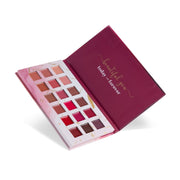 Makeup palette with various shades of lipsticks on a white background