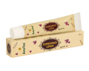 Amrita Kumkumadi Lepam with packaging on a white background