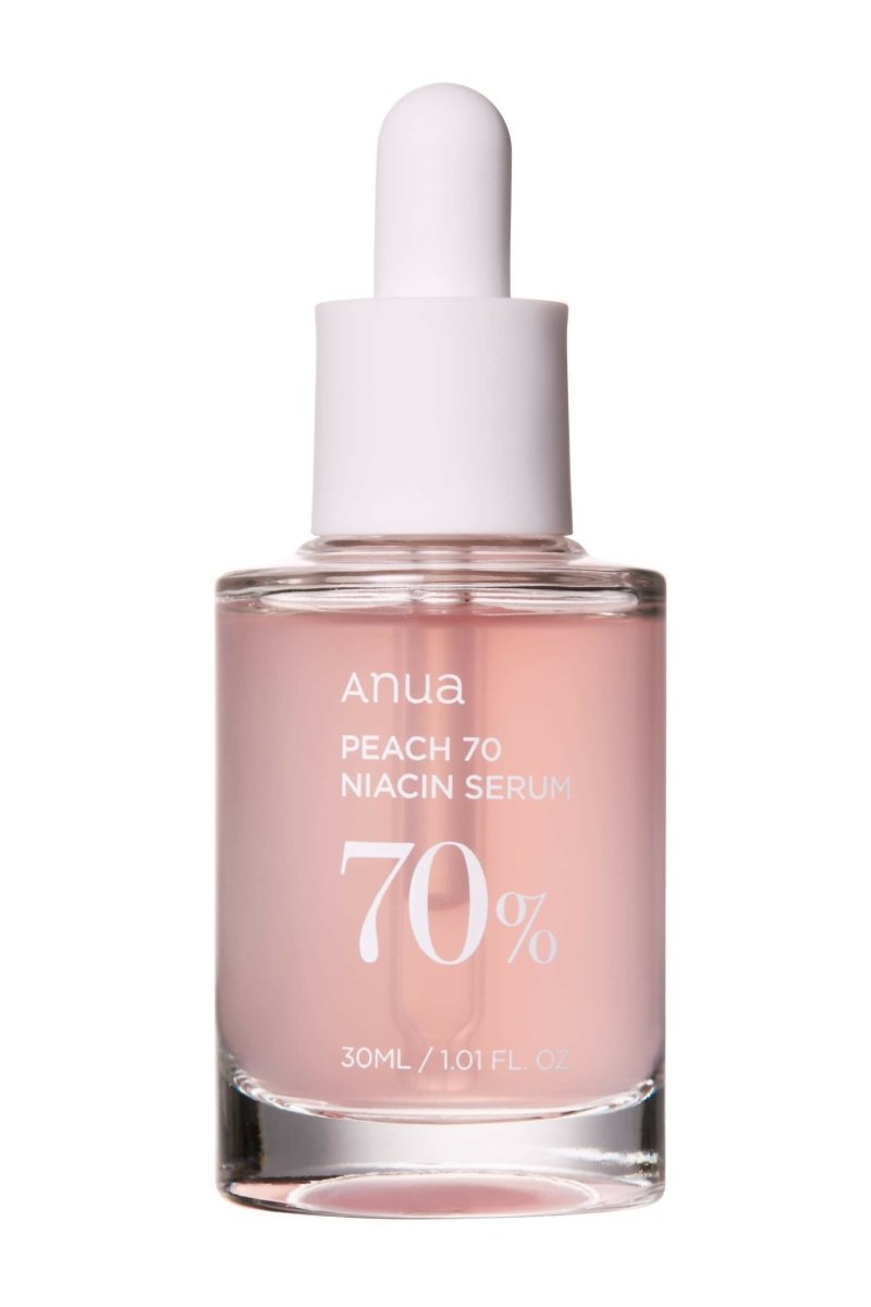 Anua Peach 70% Niacin Serum bottle with dropper on a white background