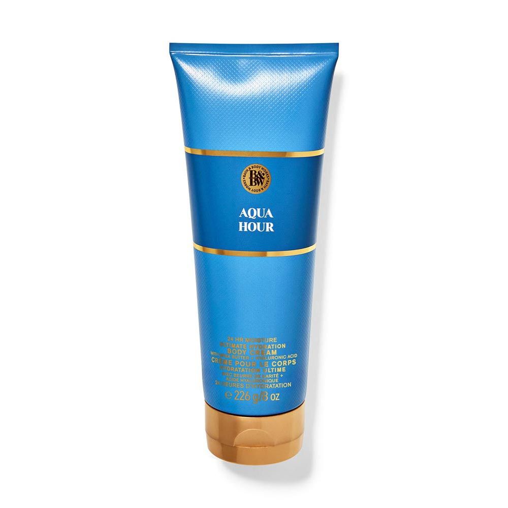 Blue tube of 'Aqua Hour' body lotion with gold accents on a white background