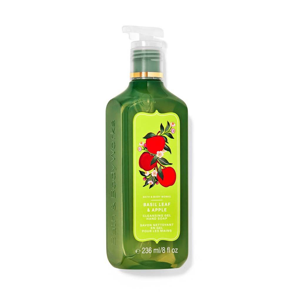 Green bottle with a label featuring apples on a white background