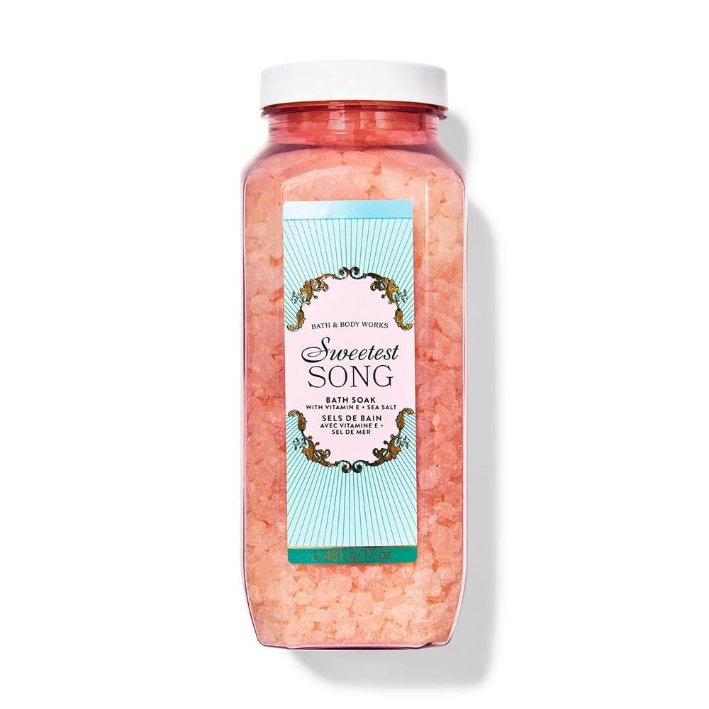 Bottle of pink bath salts with 'Sweetest Song' label on a white background