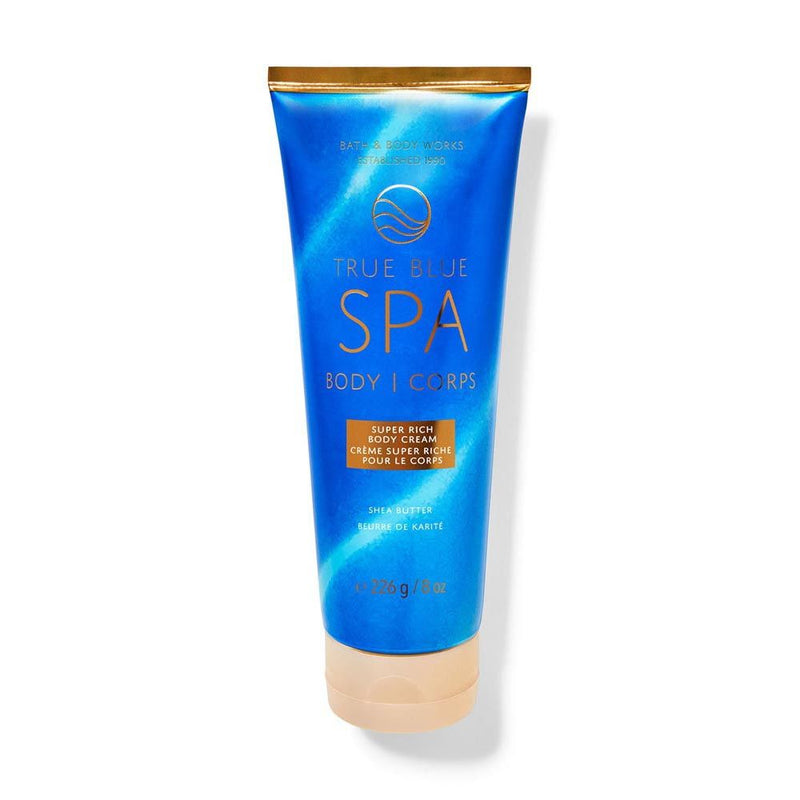 Blue tube of True Blue Spa body lotion on a white background