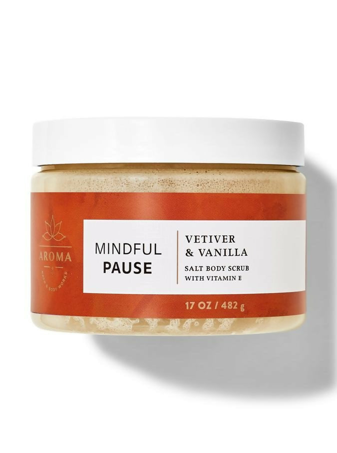 Jar of 'Mindful Pause' salt body scrub with vetiver and vanilla scent on a white background