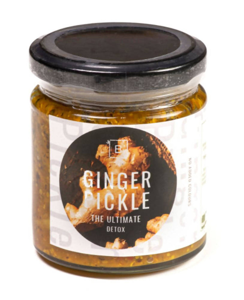 Jar of ginger pickle with a black lid on a white background