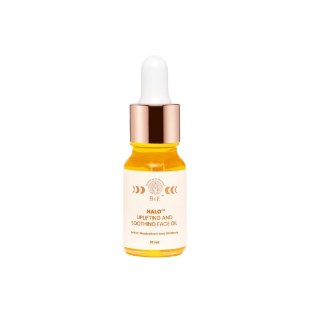 Skincare dropper bottle with yellow liquid on a white background