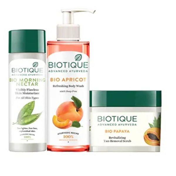 Biotique skincare products including morning nectar, apricot body wash, and papaya scrub on a white background.