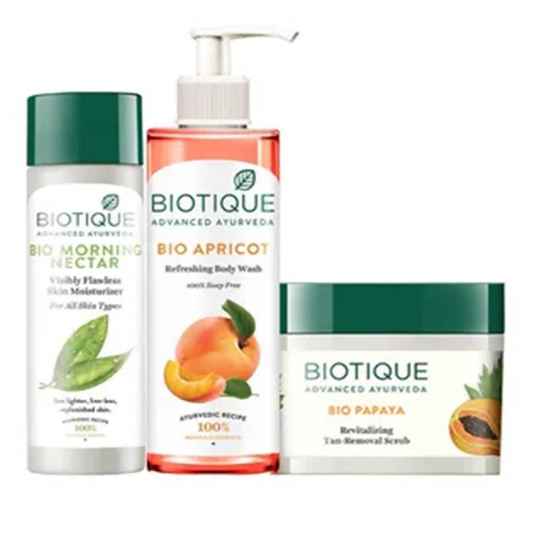 Biotique skincare products including morning nectar, apricot body wash, and papaya scrub on a white background.