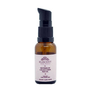 Amber glass bottle with black cap on a white background, featuring Bliscent skincare product.
