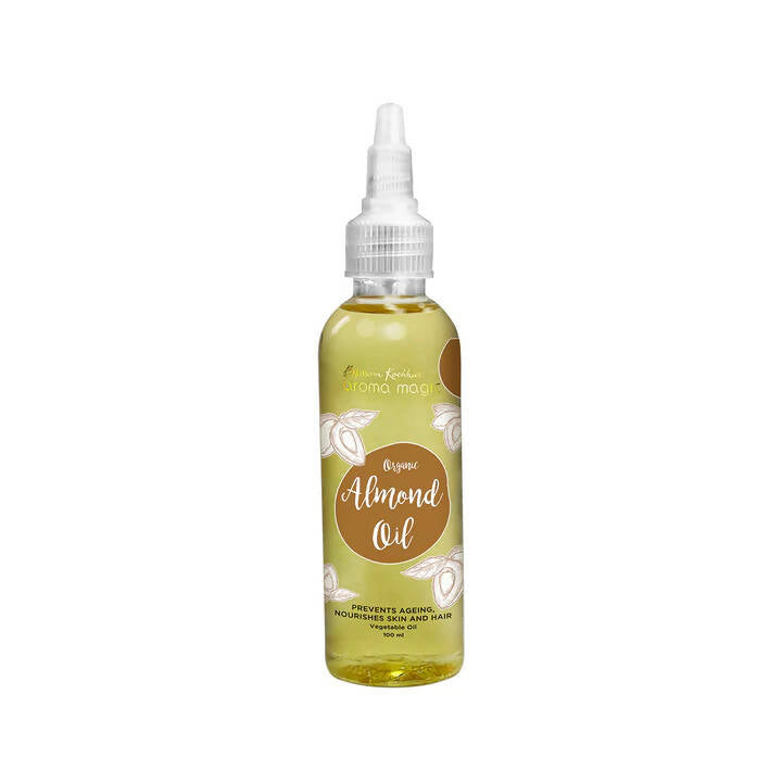 Bottle of almond oil with a white cap on a white background