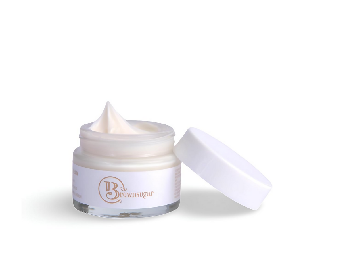 White cream jar with open lid on a white background
