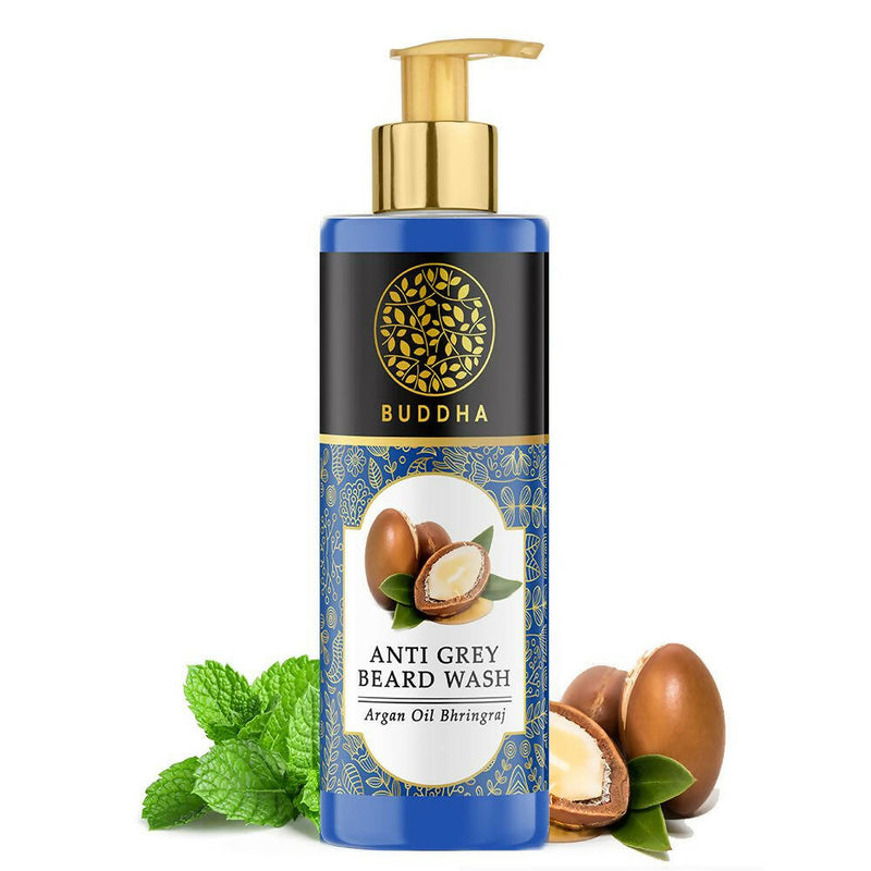 Bottle of Buddha Anti Grey Beard Wash with argan oil and mint leaves on a white background