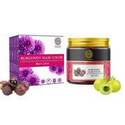Burgundy hair color product with packaging and natural ingredients on a white background