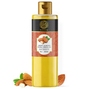 Bottle of Buddha Sweet Almond Extra Virgin Oil with almonds on a white background