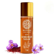 Bottle of Buddha Luxury Ayurveda Kumkumadi Tailam with flowers on a white background