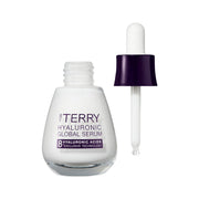 By Terry Hyaluronic Global Serum bottle with dropper on a white background