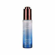 Skincare bottle with gradient blue label on a white background