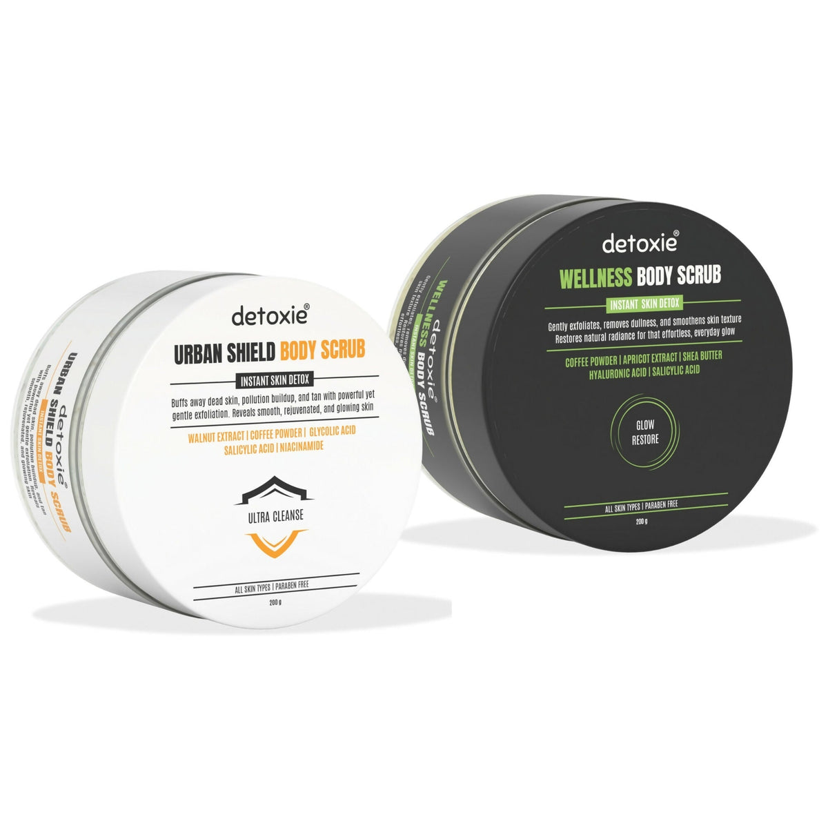 Two detoxie body scrub containers on a white background