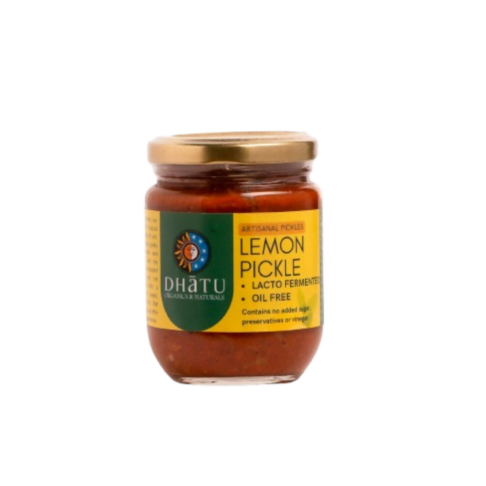 Jar of lemon pickle with Dhatu label on a white background
