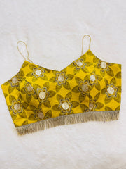 Yellow floral embroidered top with fringe on a white background