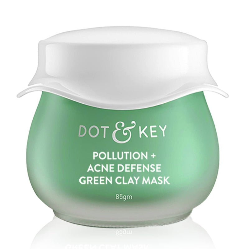 Green jar of Dot & Key Pollution + Acne Defense Green Clay Mask on a white background