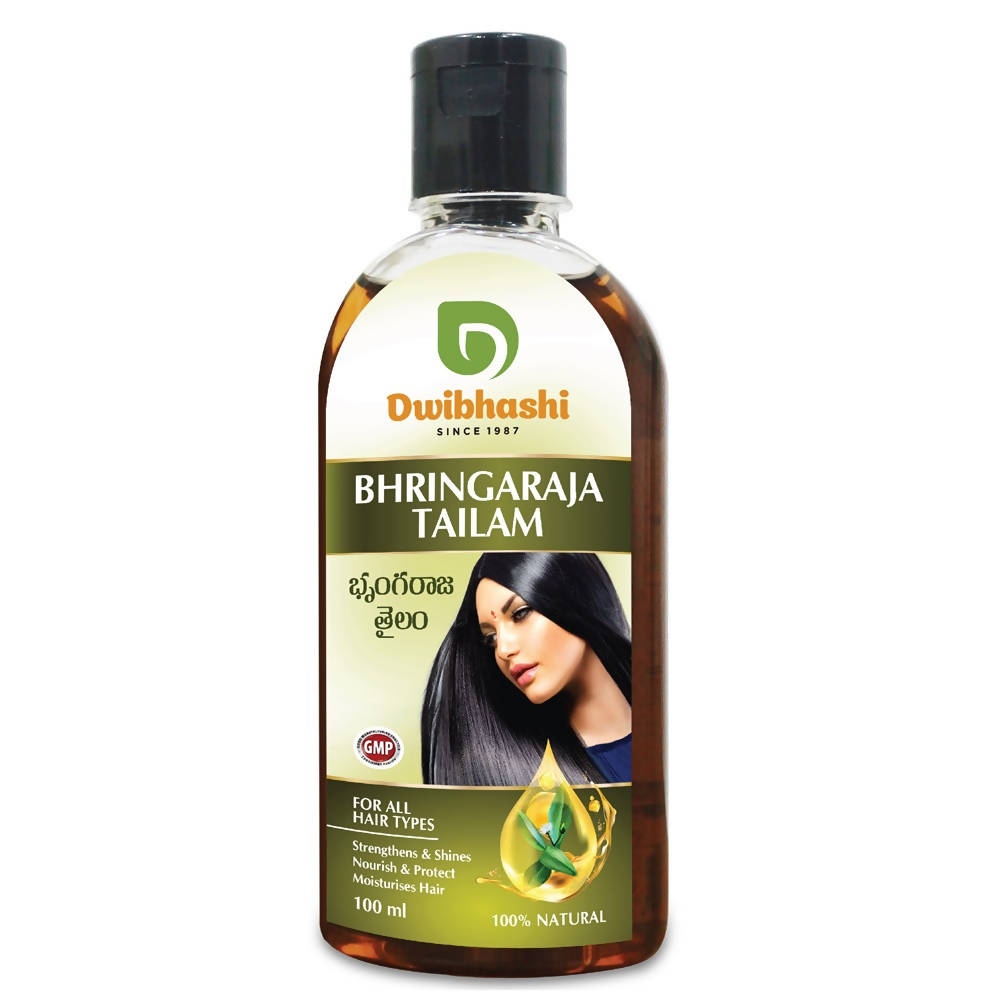 Bottle of Dwibhushi Bhringaraja Tailam hair oil with a woman's face on the label.