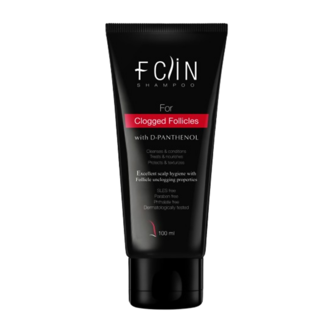 Black shampoo tube with white text on a white background