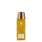 A clear bottle with a gold-colored cap containing the Forest Essentials Delicate Facial Cleanser, labeled with the brand's logo and floral imagery.