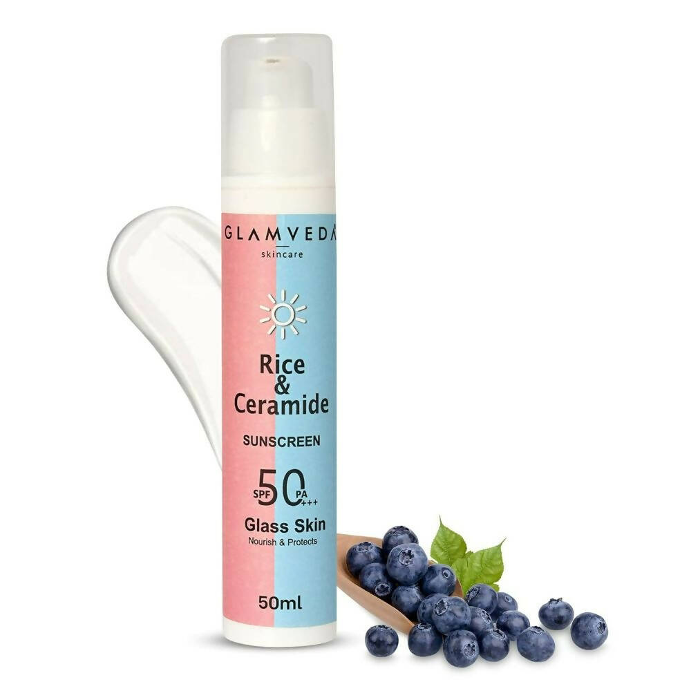 Sunscreen bottle with blueberries on a white background