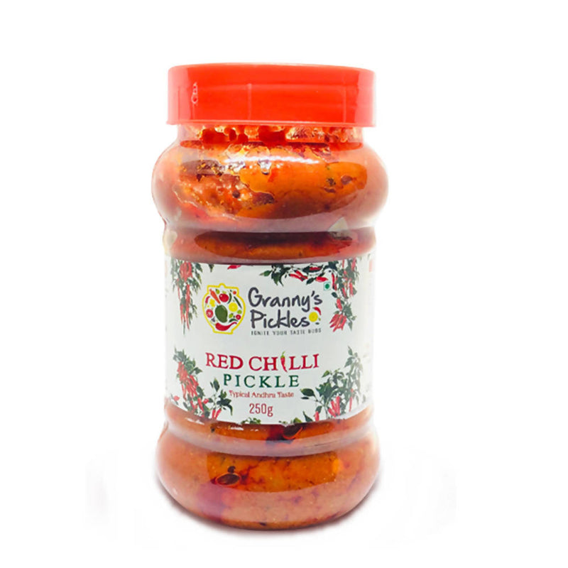 Jar of red chilli pickle with a visible label on a white background