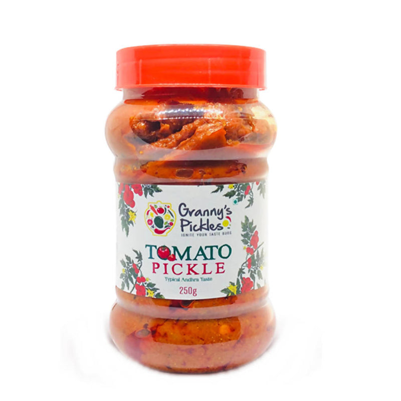 Jar of tomato pickle with red lid and 'Granny's Pickles' label on a white background