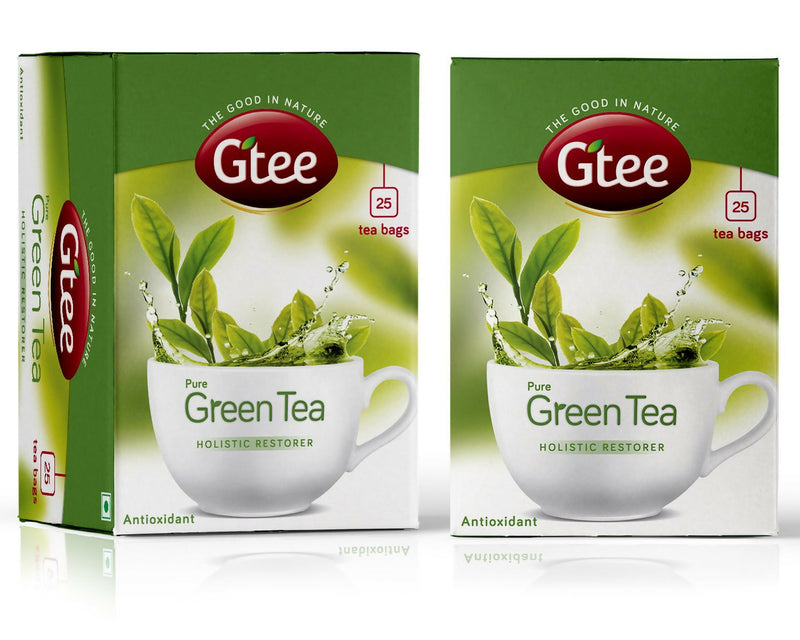 Two boxes of Gtee Pure Green Tea with a cup and tea leaves on the packaging.