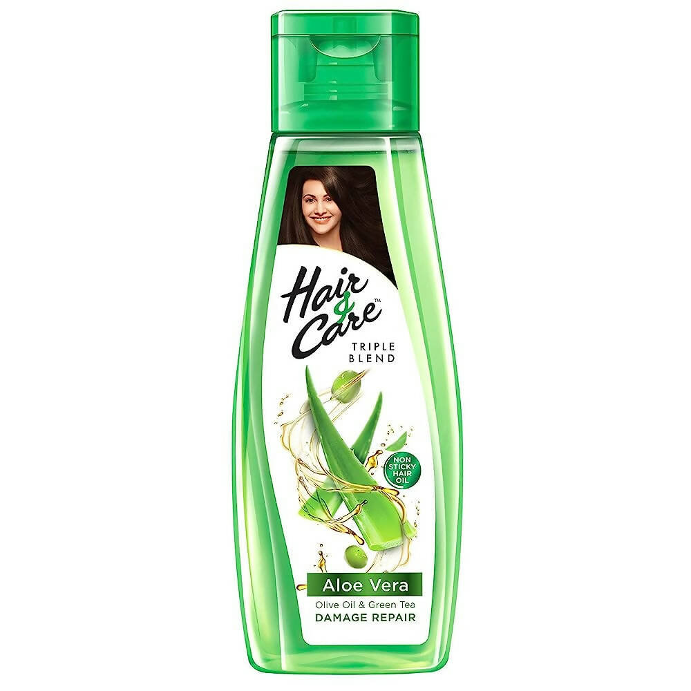 Green bottle of Hair Care Triple Blend Aloe Vera shampoo on a white background