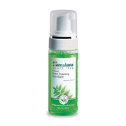 A bottle of Himalaya Herbals Purifying Neem Foaming Face Wash with a pump dispenser, labeled for skin care.