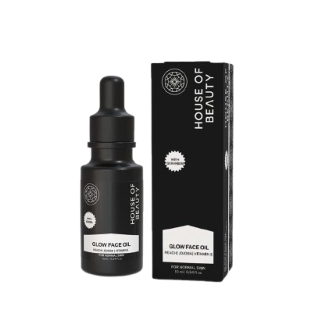Black bottle and packaging of House of Beauty Glow Face Oil on a white background