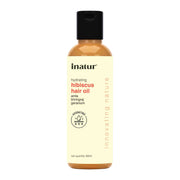 Bottle of inatur hydrating hibiscus hair oil on a white background