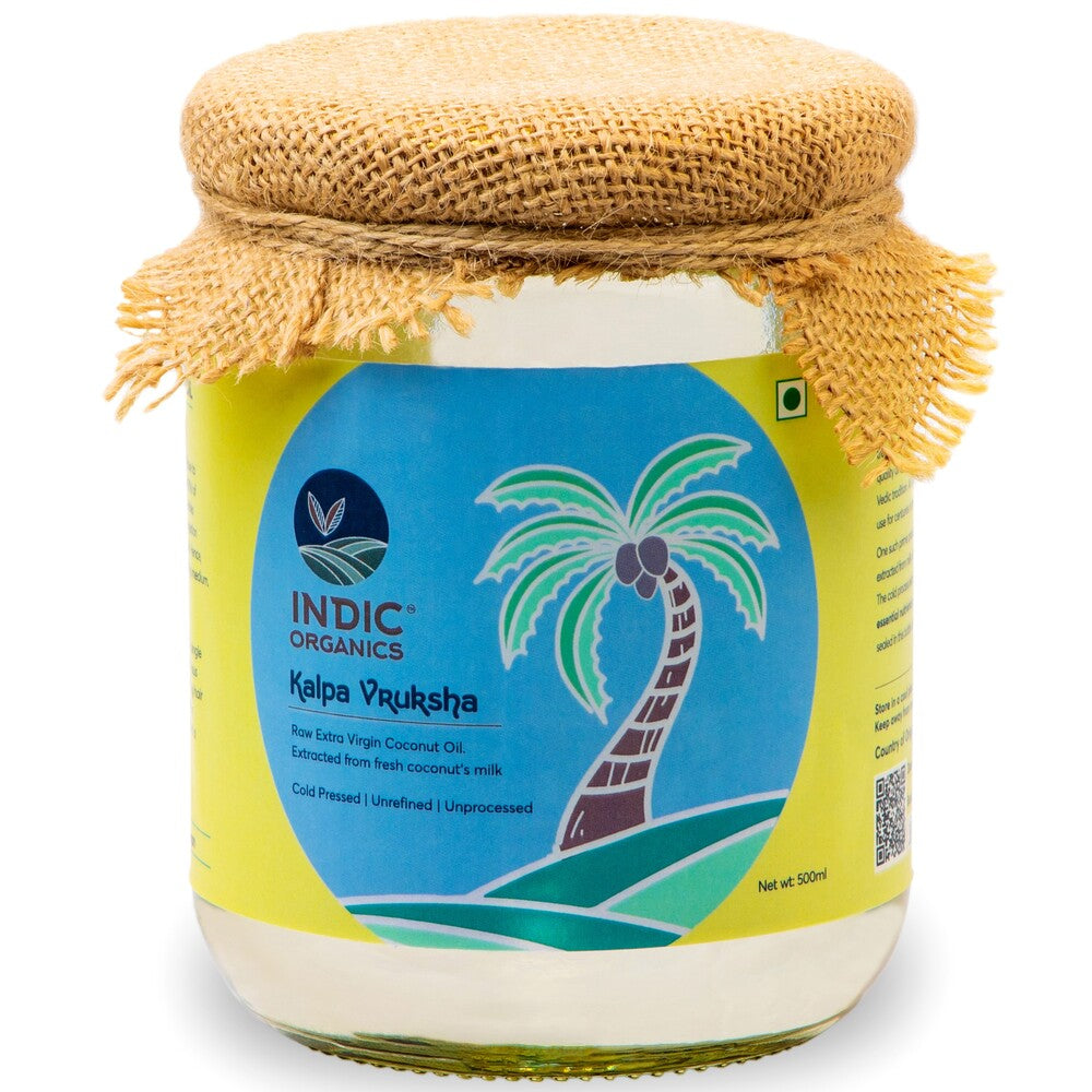 Jar of Indic Organics coconut oil with a palm tree design on the label.