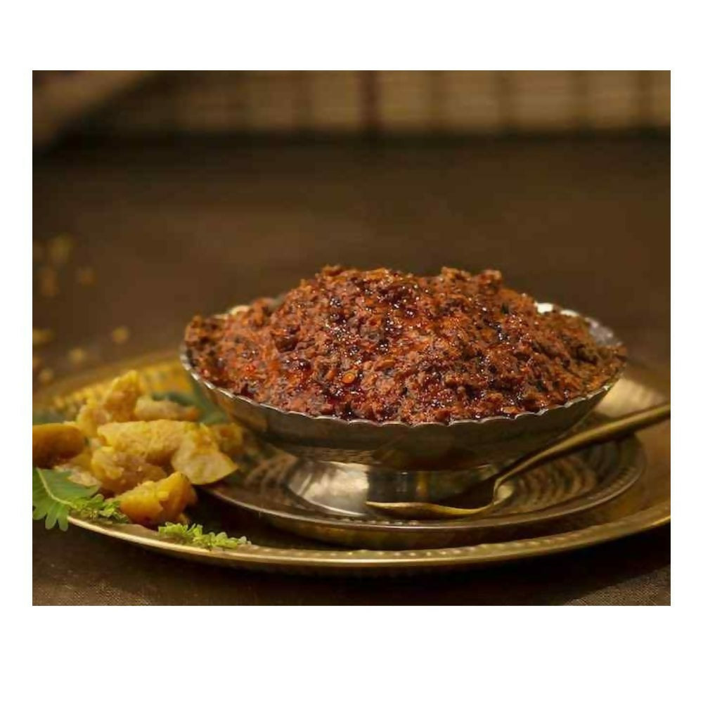 Bowl of food on a metal plate with a blurred background