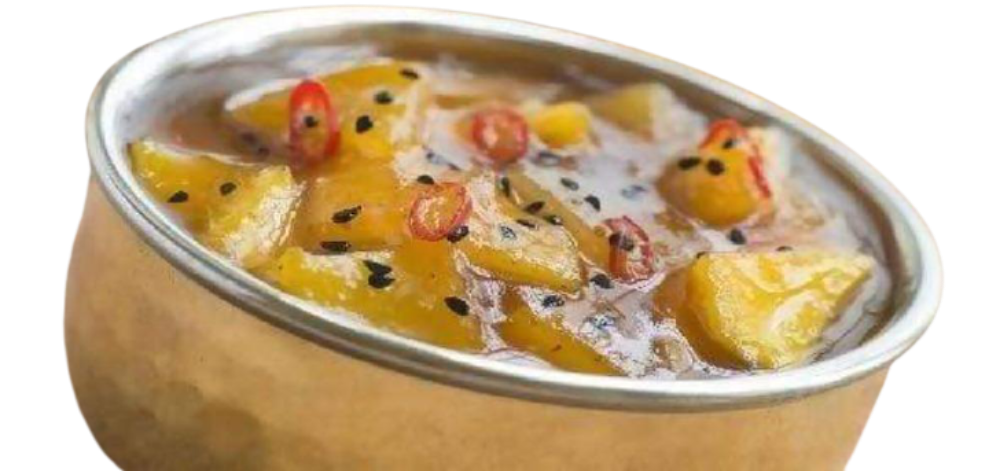 Pineapple and coconut milk dessert in a metal container on a white background