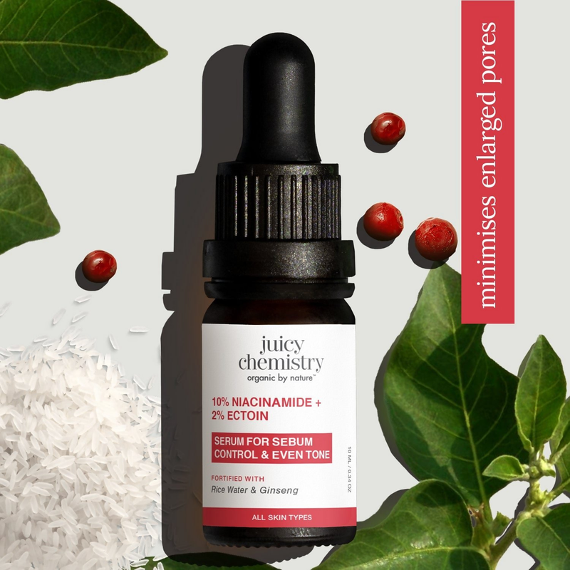 Juicy Chemistry serum bottle with ingredients on a light background