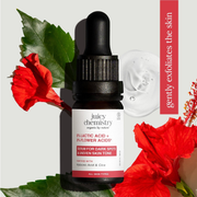 Juicy Chemistry skincare serum bottle with red flowers and green leaves on a light gray background