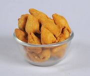 Fried snacks in a glass bowl on a white background