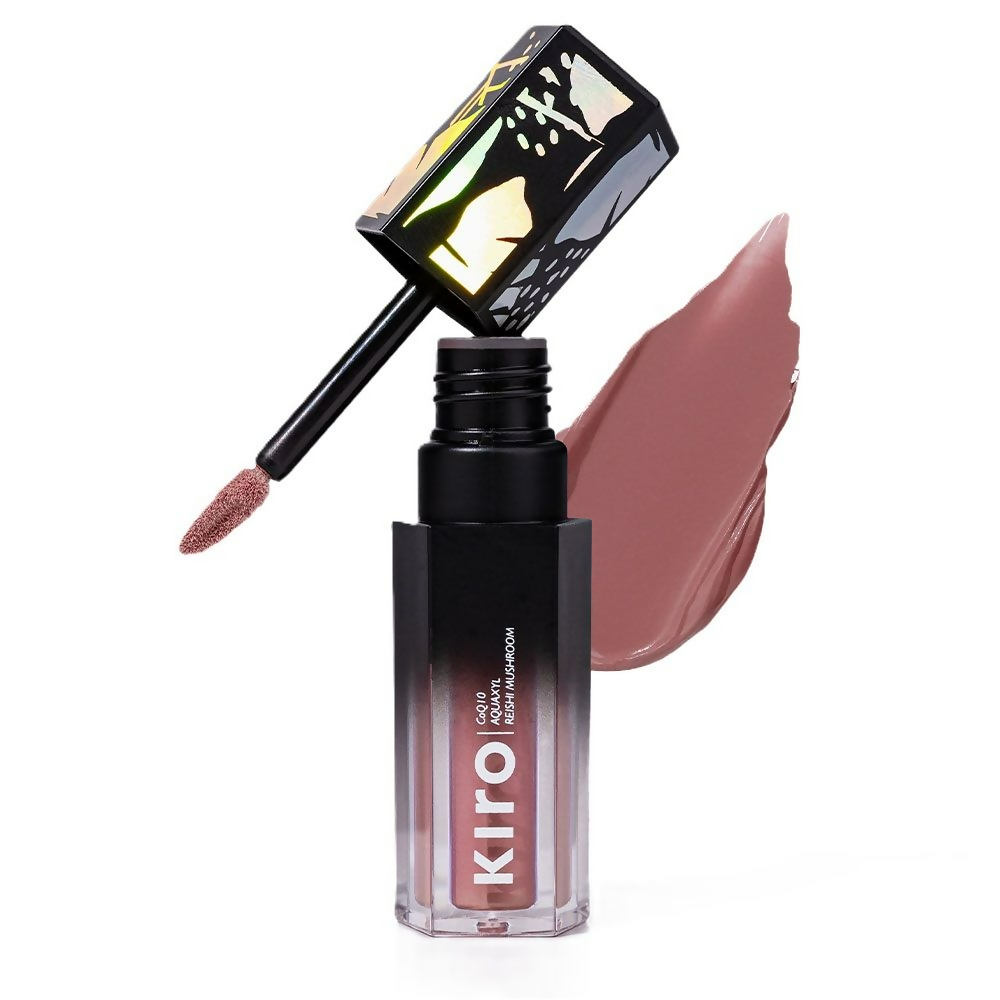 Lip gloss with applicator and swatch on a white background
