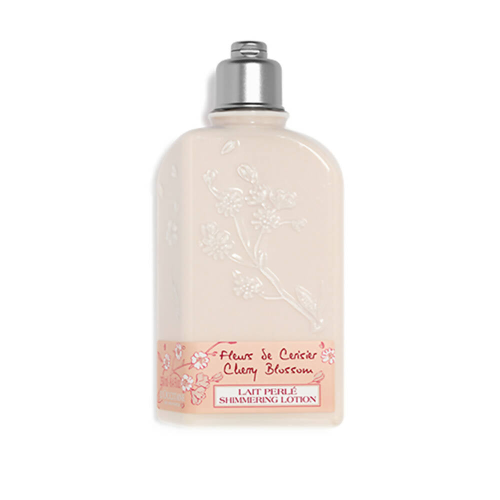 Shimmering lotion bottle with cherry blossom design on a white background