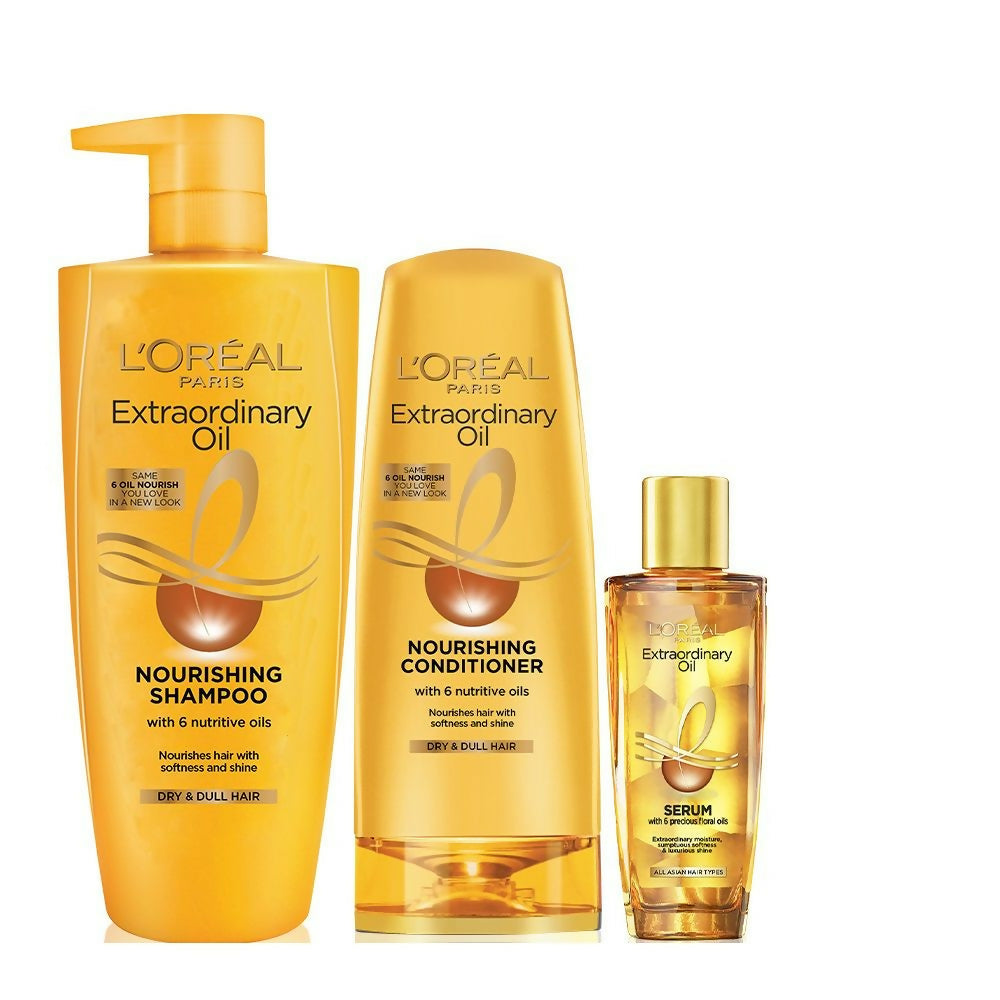 L'Oreal Extraordinary Oil shampoo, conditioner, and serum set on a white background