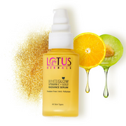 Lotus Herbals Whiteglow Vitamin C + Gold Radiance Serum with gold powder and fruits on a white background