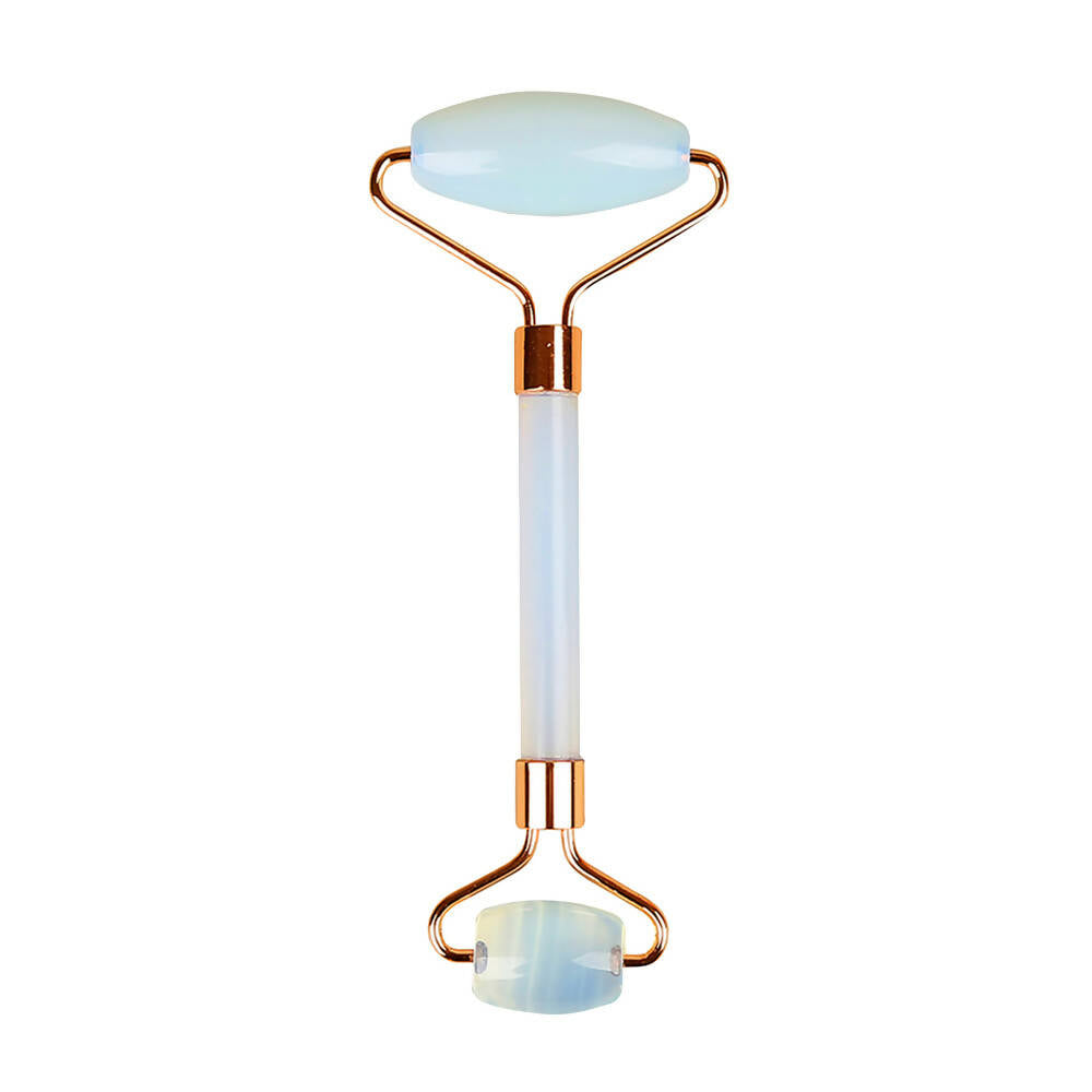 Glowing roller with white jade-like surface and gold accents on a white background